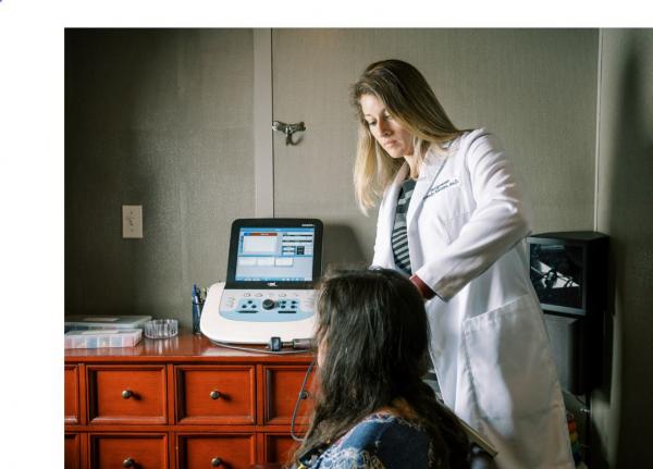 Dr. Breeden attending a patient.