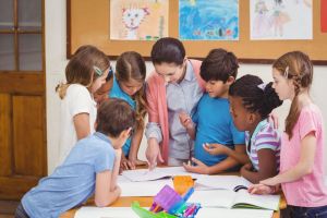 Children huddled around teacher