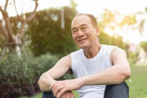 A man relaxes in a park.