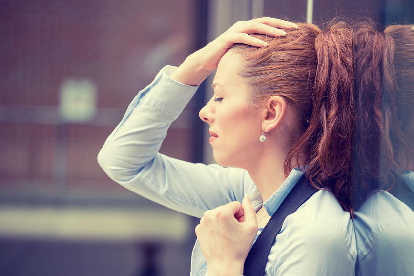 A woman grapples with an attack of Meniere's disease.