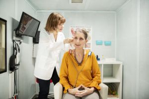 A woman receives a hearing test.