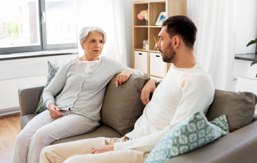 A mother and her son talk about hearing loss. 